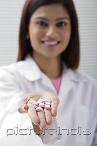 PictureIndia - Doctor with open hand of pills