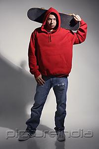 PictureIndia - young man wearing red hooded sweatshirt holding skateboard