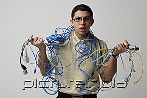 PictureIndia - Man with cords and wires around his neck