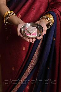 PictureIndia - Indian woman offering sweets