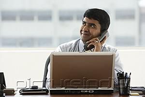 PictureIndia - business man talking on office phone