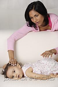 PictureIndia - woman soothing her baby to sleep