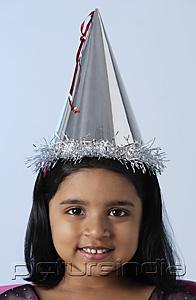 PictureIndia - Little girl wearing birthday hat