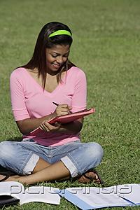 PictureIndia - young woman studying outside
