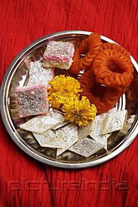 PictureIndia - Assorted Indian sweets on silver tray.
