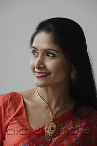 PictureIndia - Head shot of Indian woman wearing a sari and smiling