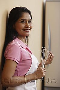 PictureIndia - Indian woman smiling in the kitchen