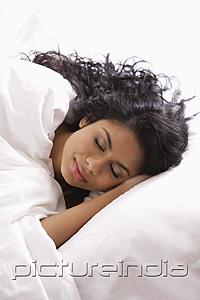 PictureIndia - Head shot of Indian woman sleeping in bed