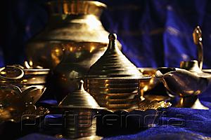 PictureIndia - Still life of brass bowls and cups on table