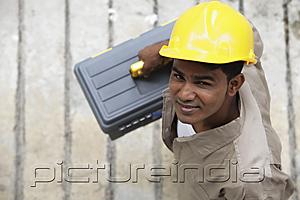 PictureIndia - Top view of man wearing construction hat