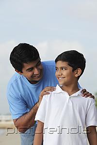 PictureIndia - Father looking at son and smiling