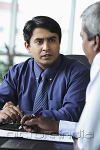 PictureIndia - Indian business man talking to colleague