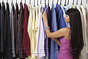PictureIndia - woman looking at rack of clothes