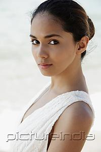 PictureIndia - head shot of young woman outside