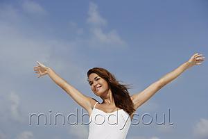 Mind Body Soul - woman with arms open wide