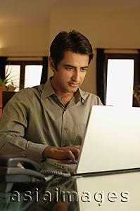 Asia Images Group - man working at laptop