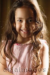 Asia Images Group - little girl with long hair smiles at camera