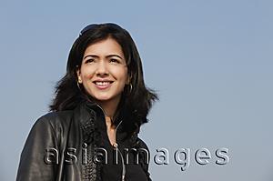 Asia Images Group - woman smiling in leather jacket (horizontal)