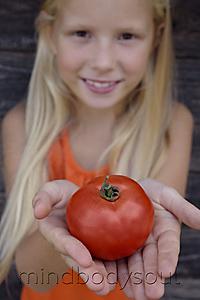 Mind Body Soul - girl holding tomato