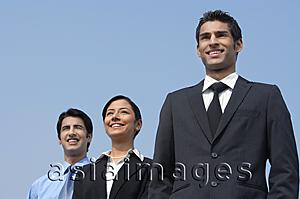 Asia Images Group - three colleagues standing, smiling