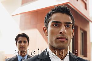Asia Images Group - two business men, facing camera (close up)