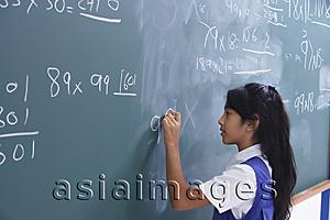 Asia Images Group - girl working at chalkboard (horizontal)