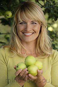 Mind Body Soul - woman with apples under apple tree