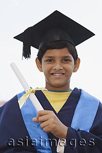 Asia Images Group - young boy graduate with diploma