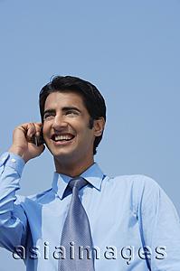 Asia Images Group - businessman on phone smiling
