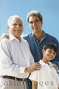Asia Images Group - Grandfather, father, son all smiling at camera (vertical)