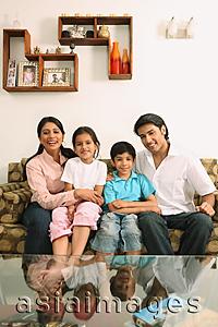 Asia Images Group - Family sitting on couch