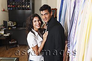 Asia Images Group - couple shopping for men's clothing