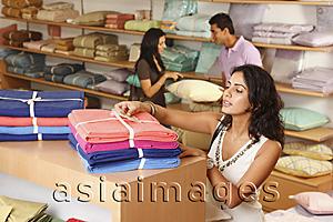 Asia Images Group - three people shopping for household items