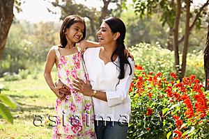 Asia Images Group - Mother and daughter hugging in park