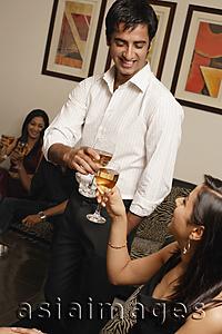 Asia Images Group - couple at party toasting each other