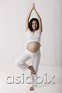 AsiaPix - Pregnant woman practicing yoga