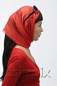 AsiaPix - Profile of woman wearing red sweater, scarf and sunglasses