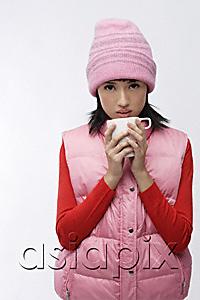 AsiaPix - Young woman in pink hat and vest with coffee cup