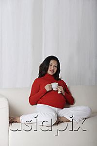AsiaPix - Pregnant woman enjoying tea