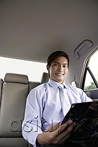 AsiaPix - Businessman in backseat of car