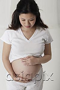 AsiaPix - Pregnant woman holding her stomach