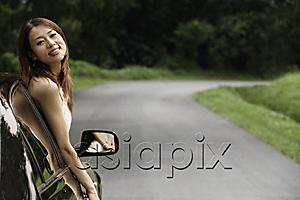 AsiaPix - Woman hanging out car window