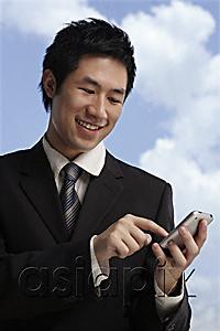 AsiaPix - businessman using hand held device