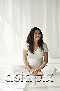 AsiaPix - Pregnant woman doing yoga