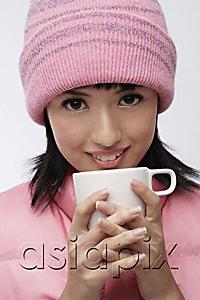 AsiaPix - Young woman in pink hat and vest with coffee cup
