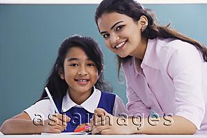 Asia Images Group - teacher and student smile at camera (horizontal)