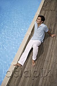 AsiaPix - Man reclining by pool
