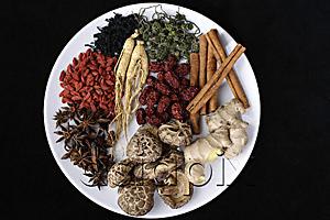 AsiaPix - Still life of natural items such as cinnamon sticks, ginger root, mushrooms, star anise, etc.