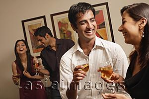 Asia Images Group - two couples at party, laughing