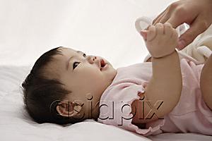 AsiaPix - baby girl holding woman's hand